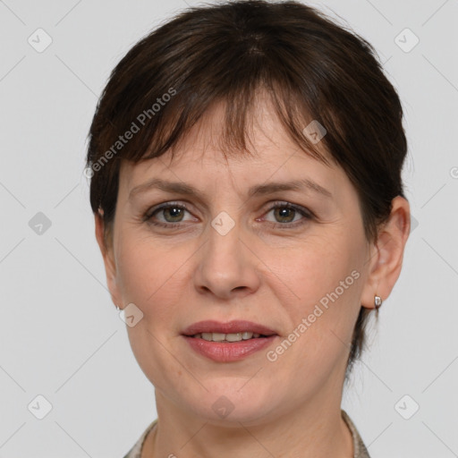 Joyful white adult female with medium  brown hair and grey eyes