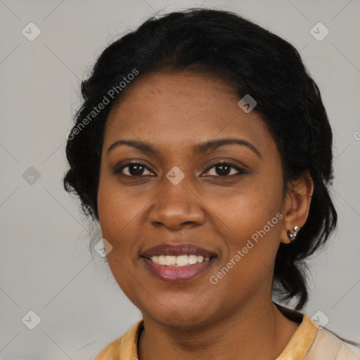 Joyful latino adult female with medium  black hair and brown eyes