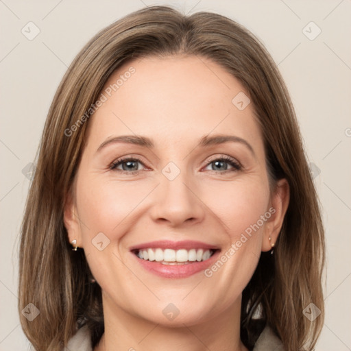 Joyful white young-adult female with medium  brown hair and green eyes