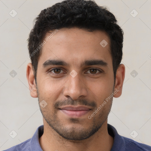 Joyful white young-adult male with short  black hair and brown eyes