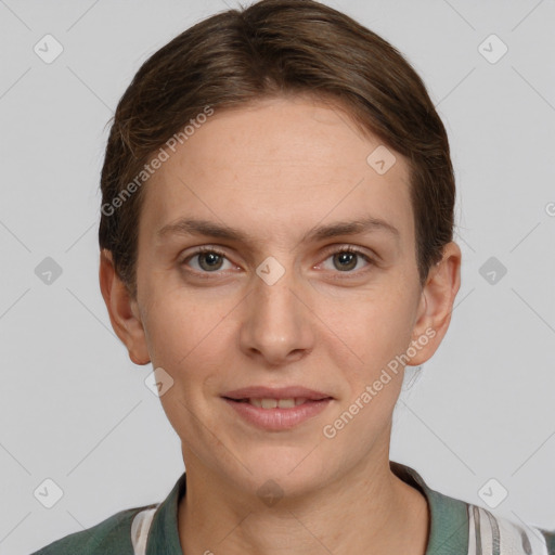 Joyful white young-adult female with short  brown hair and grey eyes