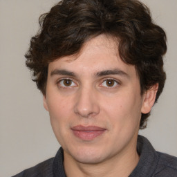 Joyful white young-adult male with medium  brown hair and brown eyes