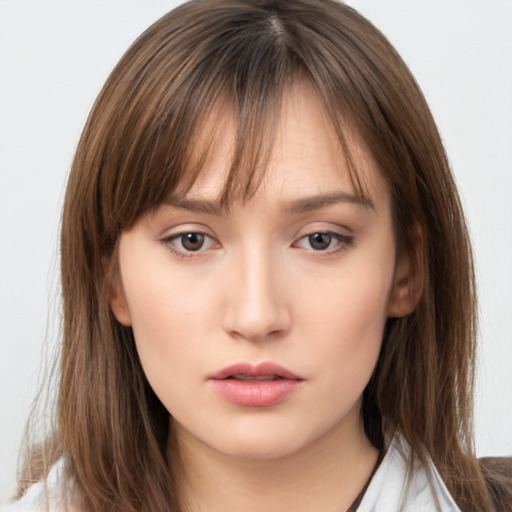 Neutral white young-adult female with medium  brown hair and brown eyes