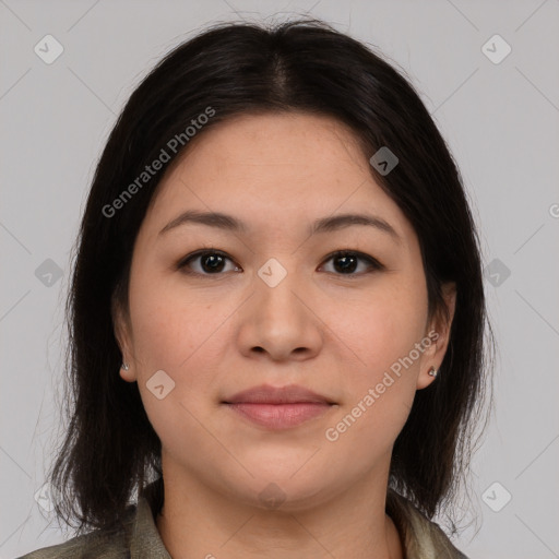 Joyful latino young-adult female with medium  brown hair and brown eyes