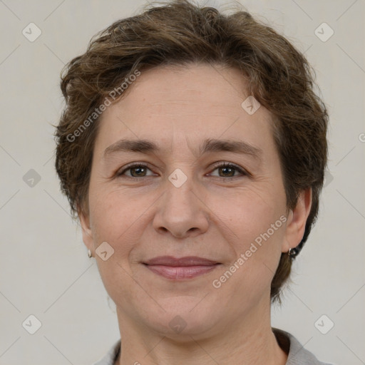 Joyful white adult female with short  brown hair and brown eyes