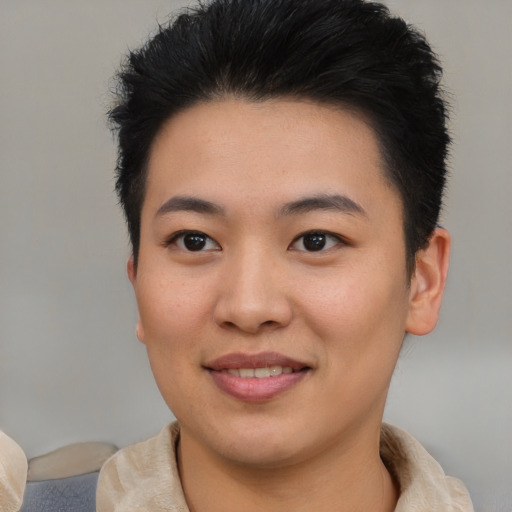 Joyful asian young-adult female with short  brown hair and brown eyes