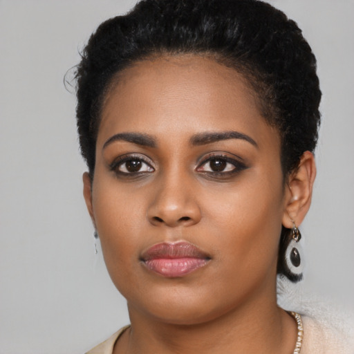 Neutral black young-adult female with short  black hair and brown eyes