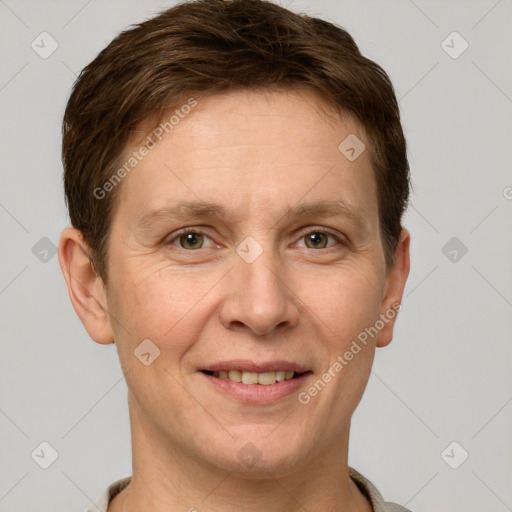 Joyful white adult female with short  brown hair and grey eyes