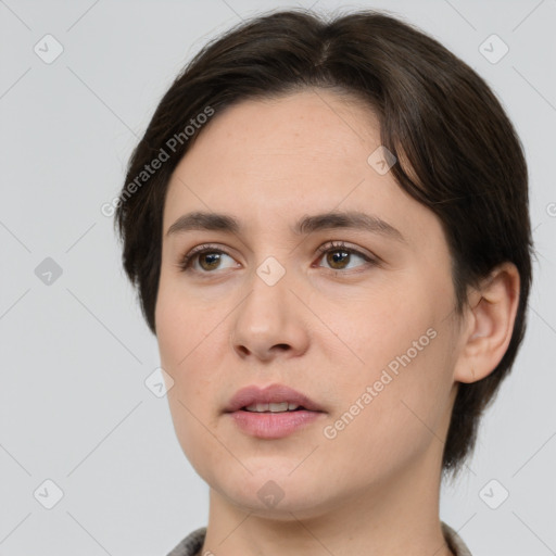 Joyful white young-adult female with medium  brown hair and brown eyes