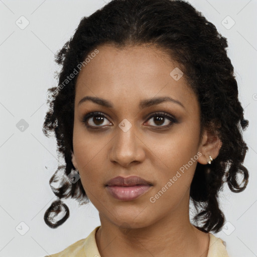 Joyful black young-adult female with medium  brown hair and brown eyes