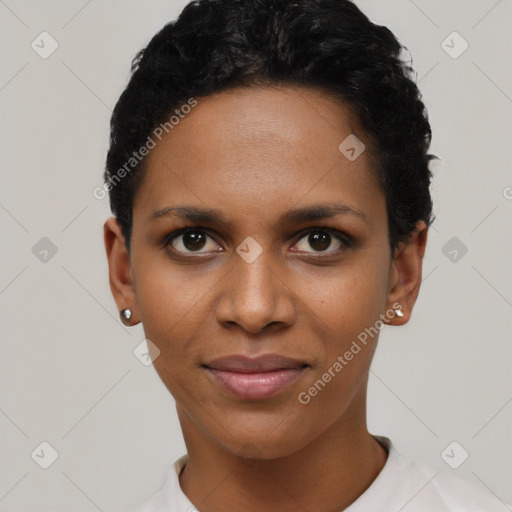 Joyful black young-adult female with short  black hair and brown eyes