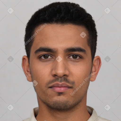 Neutral latino young-adult male with short  black hair and brown eyes