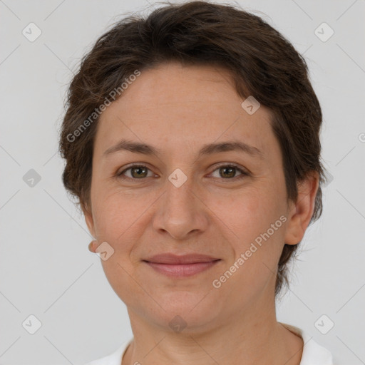 Joyful white adult female with short  brown hair and brown eyes