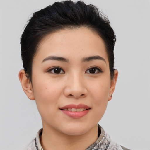 Joyful asian young-adult female with short  brown hair and brown eyes