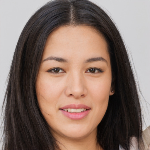 Joyful asian young-adult female with long  brown hair and brown eyes