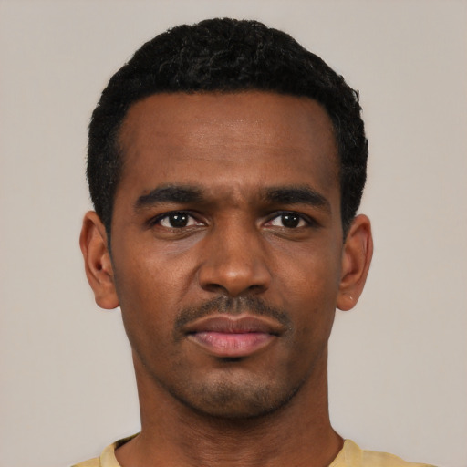 Neutral black young-adult male with short  black hair and brown eyes