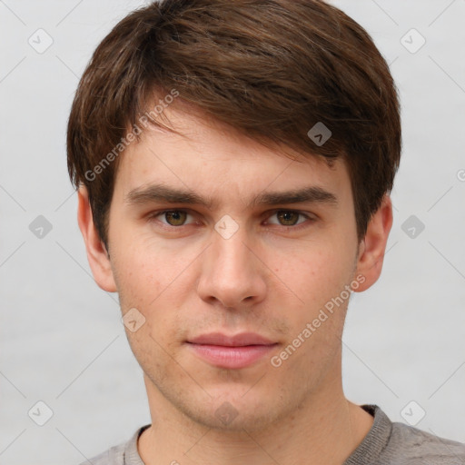 Neutral white young-adult male with short  brown hair and grey eyes