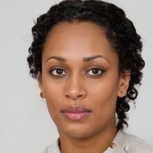 Neutral black young-adult female with medium  black hair and brown eyes