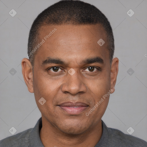 Joyful latino young-adult male with short  brown hair and brown eyes