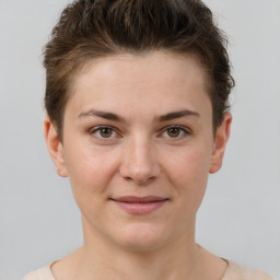 Joyful white young-adult female with short  brown hair and brown eyes