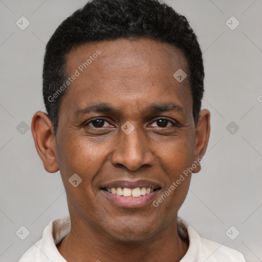 Joyful latino adult male with short  black hair and brown eyes