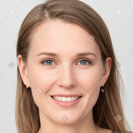 Joyful white young-adult female with long  brown hair and grey eyes