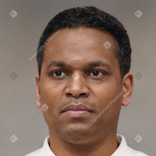 Neutral latino adult male with short  brown hair and brown eyes