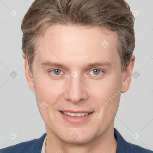 Joyful white adult male with short  brown hair and grey eyes