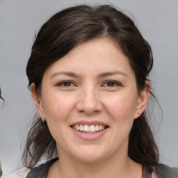 Joyful white young-adult female with medium  brown hair and brown eyes