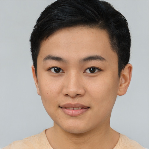 Joyful asian young-adult female with short  brown hair and brown eyes