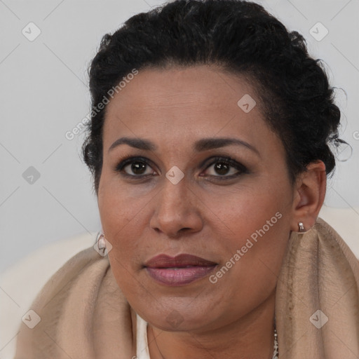 Joyful black adult female with short  brown hair and brown eyes