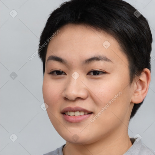 Joyful asian young-adult female with short  brown hair and brown eyes