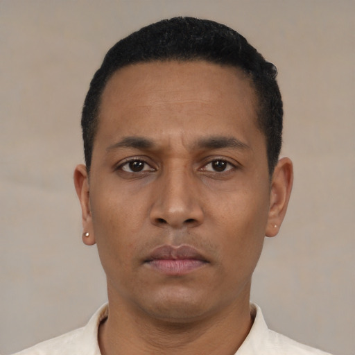 Neutral latino young-adult male with short  black hair and brown eyes