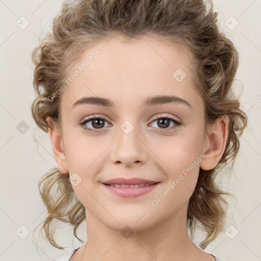 Joyful white child female with medium  brown hair and brown eyes