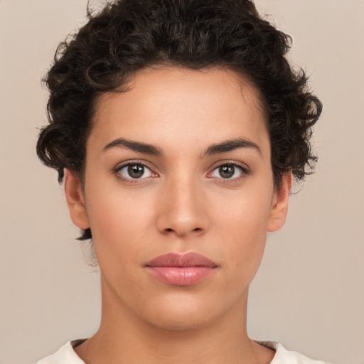 Neutral white young-adult female with short  brown hair and brown eyes