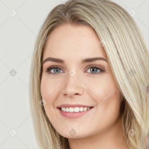 Joyful white young-adult female with long  brown hair and green eyes