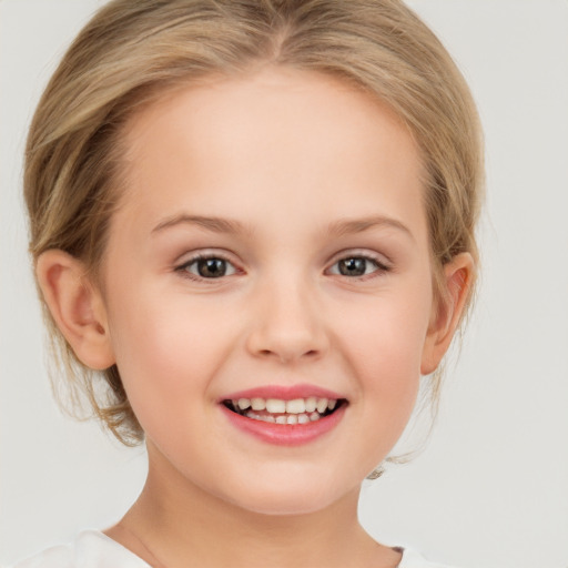 Joyful white child female with medium  blond hair and grey eyes