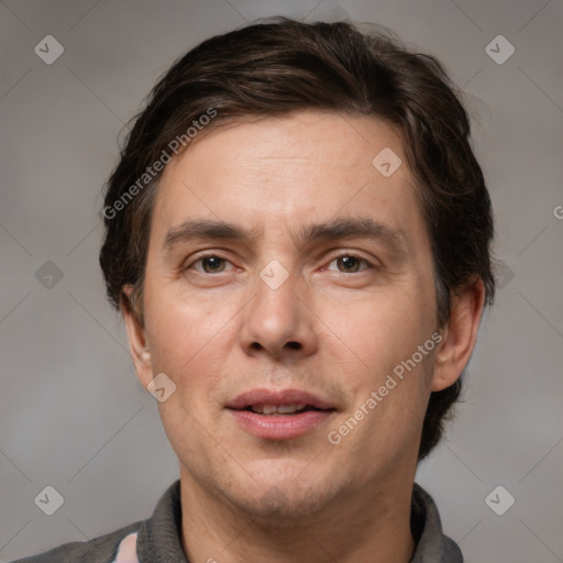 Joyful white adult male with short  brown hair and brown eyes