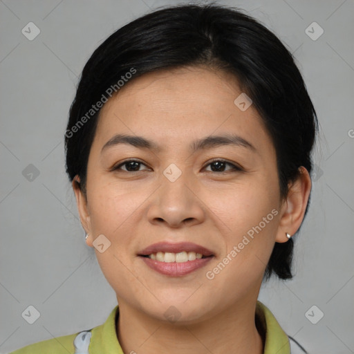 Joyful asian young-adult female with medium  brown hair and brown eyes