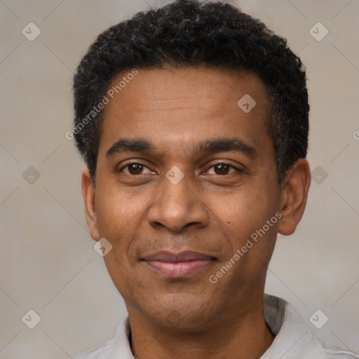 Joyful latino adult male with short  black hair and brown eyes