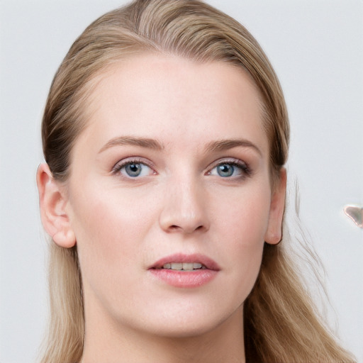 Joyful white young-adult female with long  brown hair and blue eyes