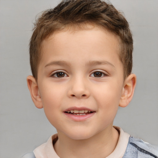 Joyful white child male with short  brown hair and brown eyes