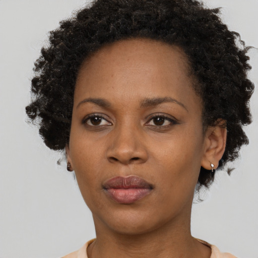 Neutral black young-adult female with short  brown hair and brown eyes