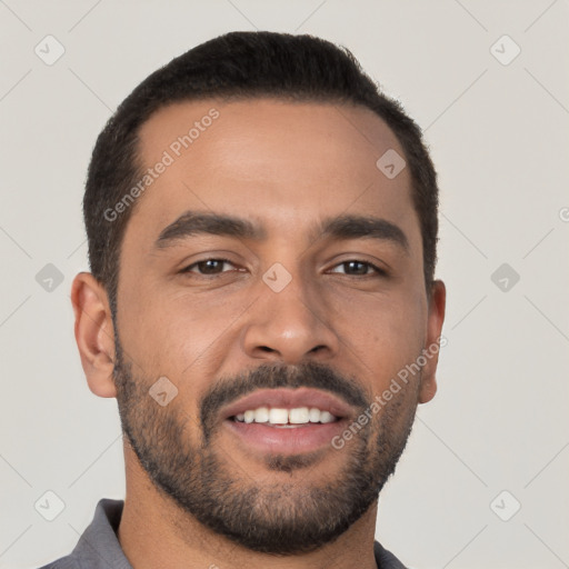 Joyful latino young-adult male with short  black hair and brown eyes