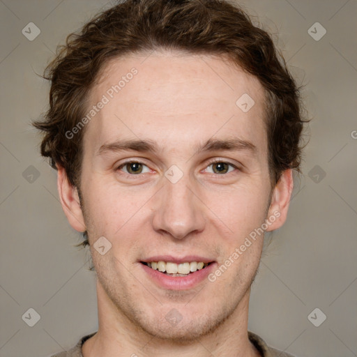 Joyful white adult male with short  brown hair and grey eyes