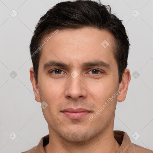 Joyful white young-adult male with short  brown hair and brown eyes