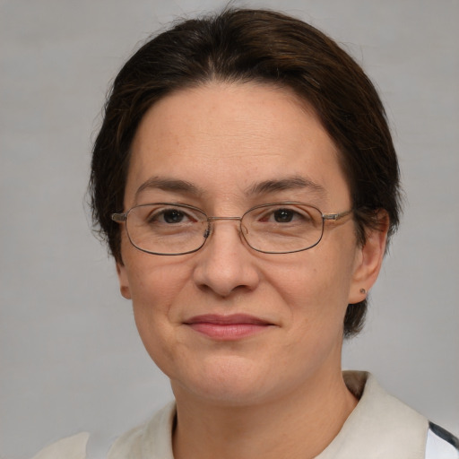 Joyful white adult female with short  brown hair and brown eyes