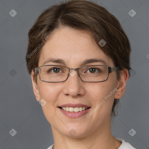 Joyful white adult female with short  brown hair and brown eyes