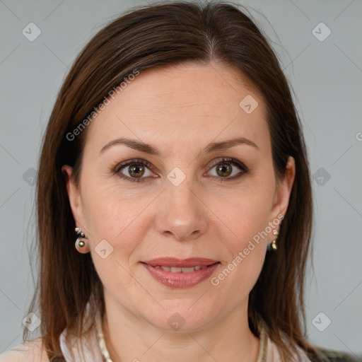 Joyful white adult female with medium  brown hair and brown eyes