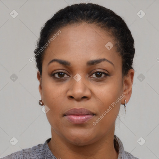 Joyful black young-adult female with short  black hair and brown eyes